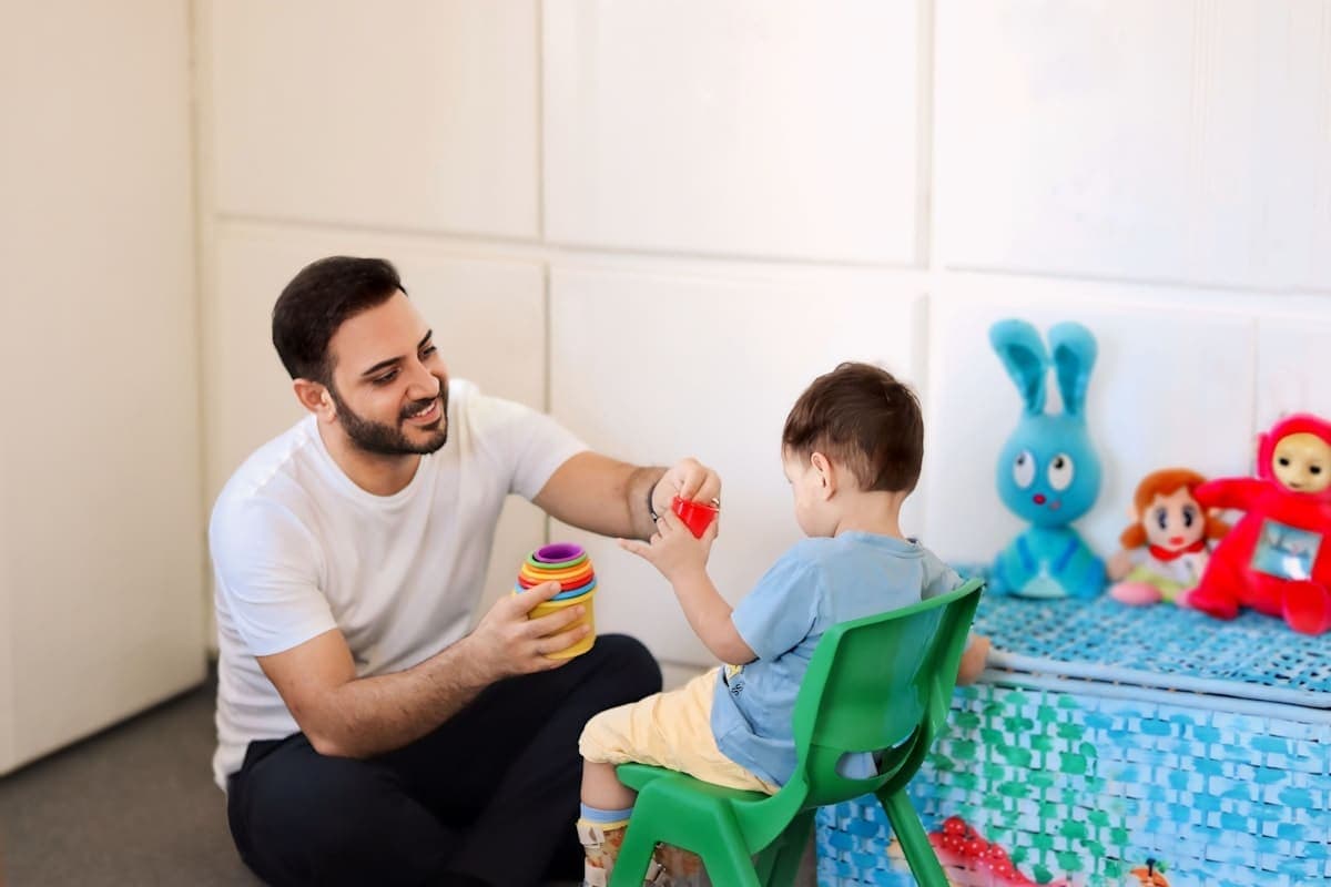 Child engaging in home-based ABA therapy session with therapist