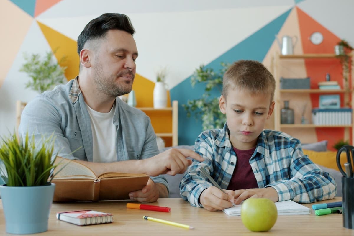 Parent and therapist partnering during a coaching session to support the child's progress\