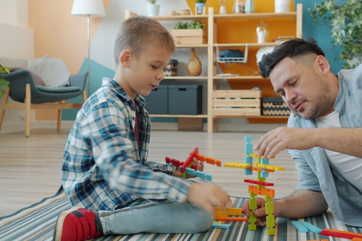 Father and child engaging in learning play activities