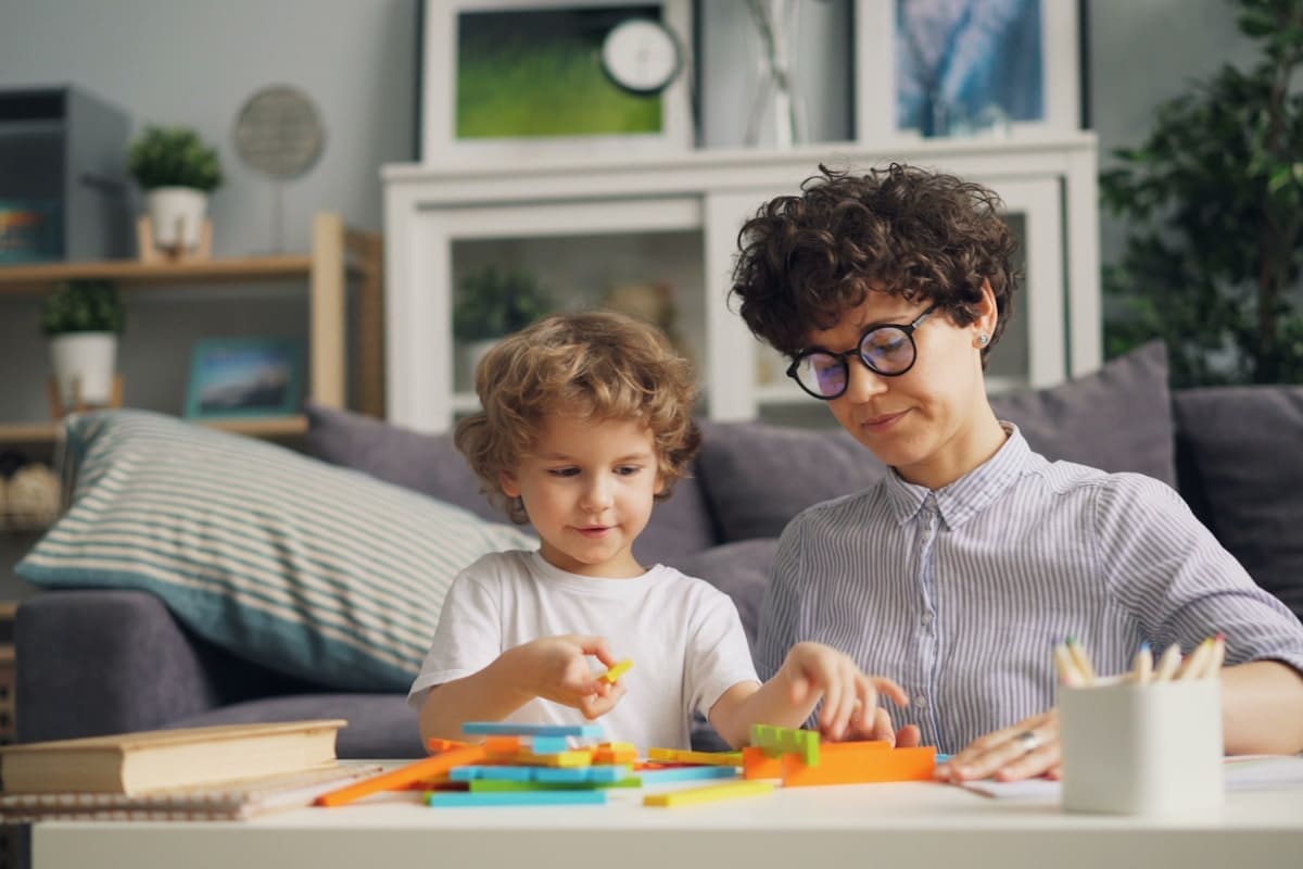 Communication development session with child and supportive therapist