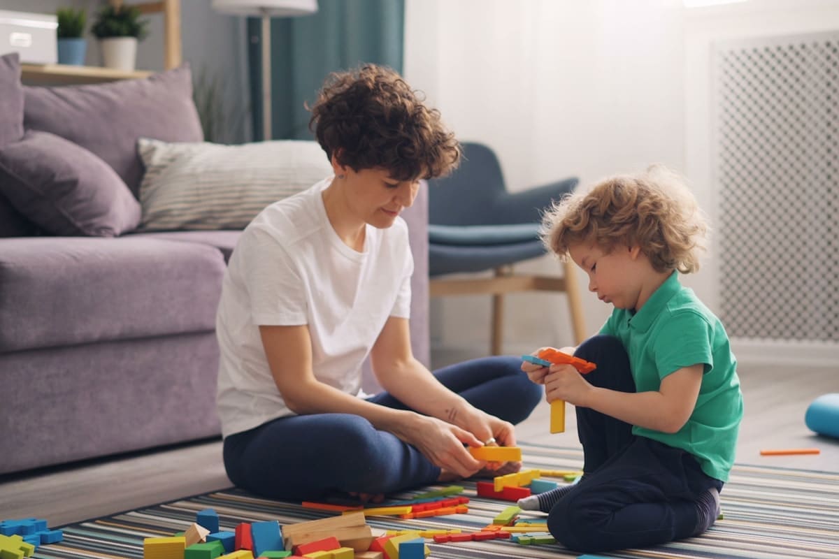 Child and therapist practicing communication skills during a home-based ABA session